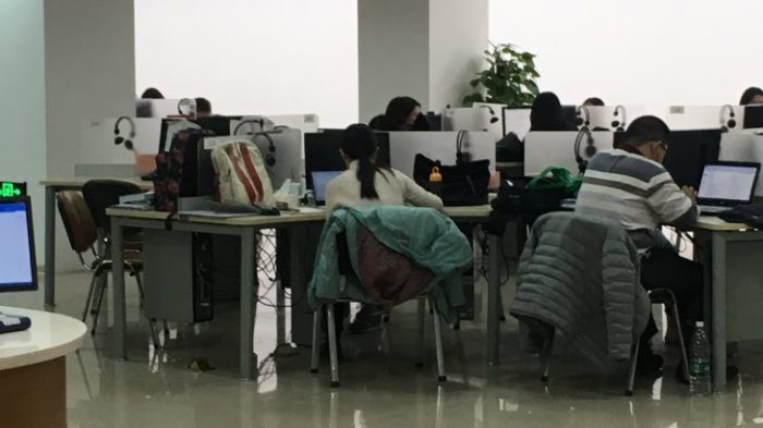 students studying at computers in computer lab